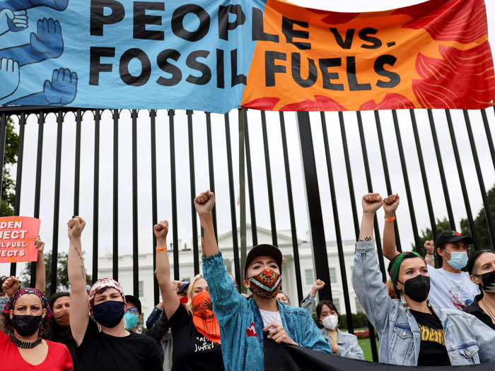 Protestors held signs that read "People vs Fossil Fuels", "Protect Native Lands," "Biden, reject fossil fuel projects."