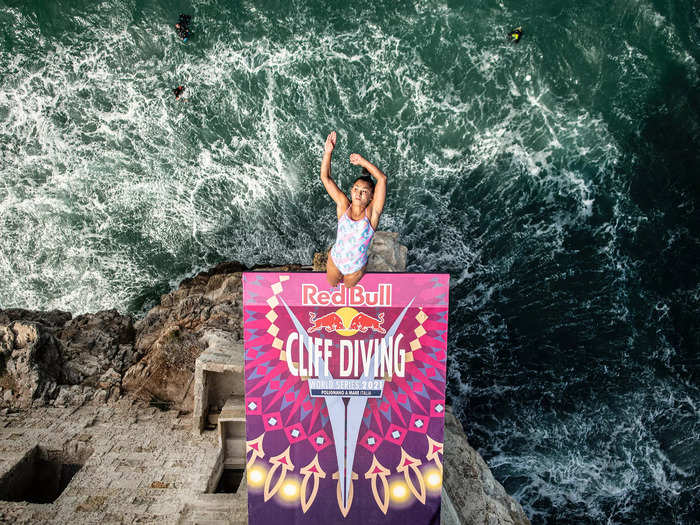 9/22: Australian Xantheia Pennisi dives from the 21 meter platform during the Red Bull Cliff Diving World Series in Polignano a Mare, Italy.