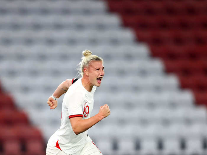 9/17: Bethany England celebrates scoring her second goal of the match for England.