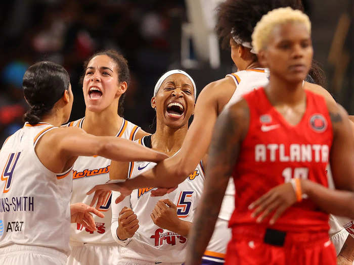 9/8: Phoenix Mercury players celebrate beating the Atlanta Dream in a close WNBA game.