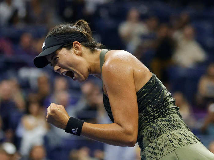 9/5: Spanish tennis star Garbine Muguruza celebrates winning a point during a US Open match.