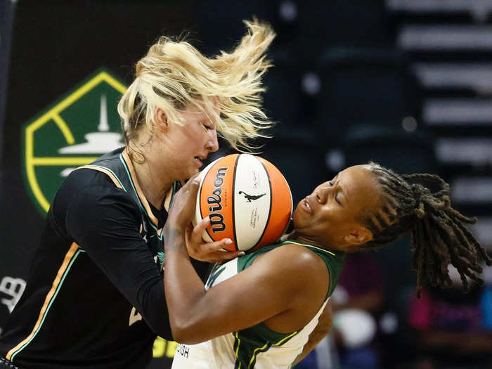 9/2: Kylee Shook and Epiphanny Prince battle for a ball during a WNBA game between the New York Liberty and Seattle Storm.