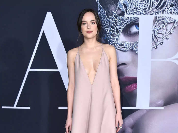 She wore another bold blush look in 2017. At the "Fifty Shades Darker" premiere, Johnson arrived in a shapeless Valentino gown with a V neckline that plunged below her chest.