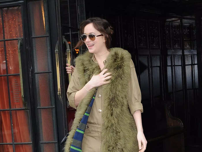 She showed an unconventional side of her style in 2015 when she wore a fuzzy green vest over a tan jumpsuit. Johnson also added strappy heels and sunglasses.