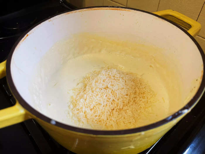 The sauce calls for grated Parmesan cheese, heavy cream, cream cheese, and chicken broth.