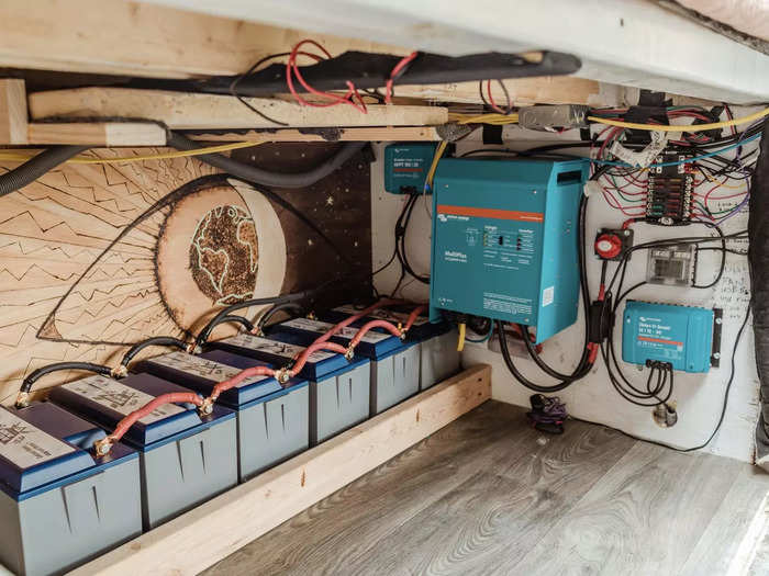 Under the bed on the backside, Nat and Abi store their electrical system. They said their van runs on batteries and solar power.