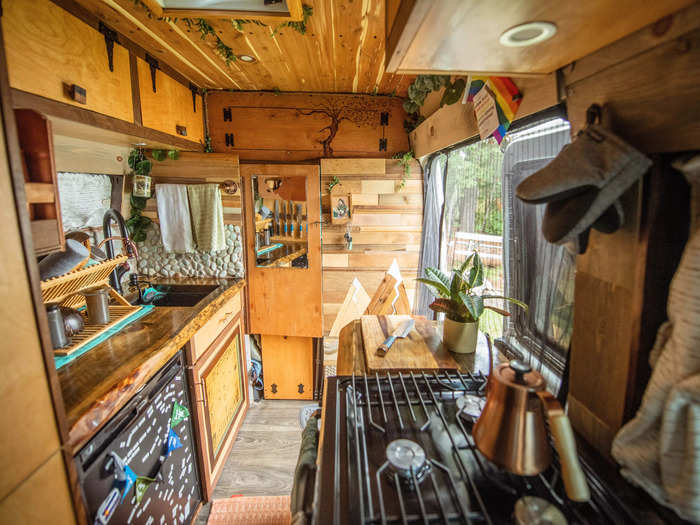 The other side of the kitchen has a stovetop, oven, and counter space.