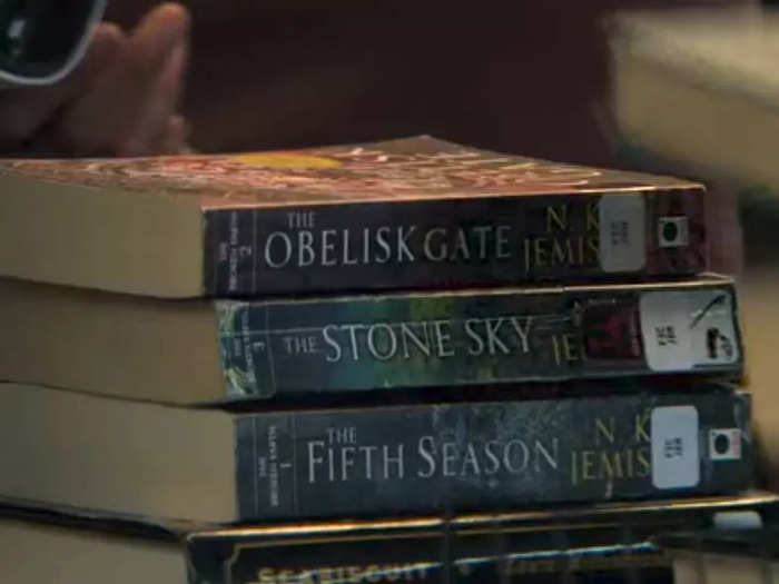 Natalie takes multiple books out of the library, including one that hints at the season