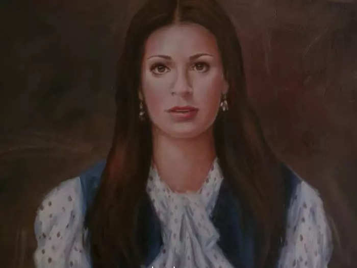 There seems to be a portrait of Rachel in her house.