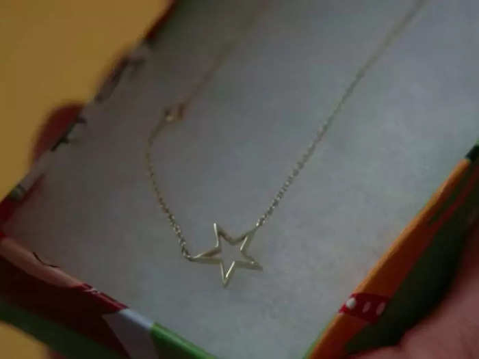 The necklace Finn gives Rachel features a gold star, which she mentioned as her signature during the previous season.