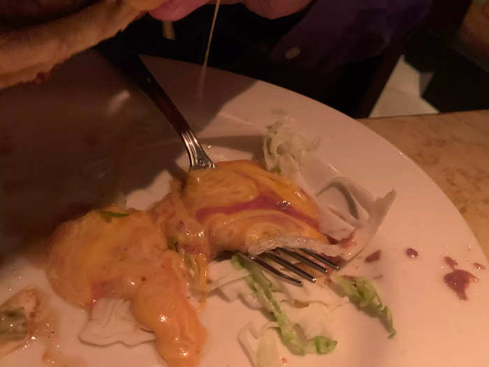 He said it was good, covered in a yummy cheese sauce that burst out the sides when he took a bite.