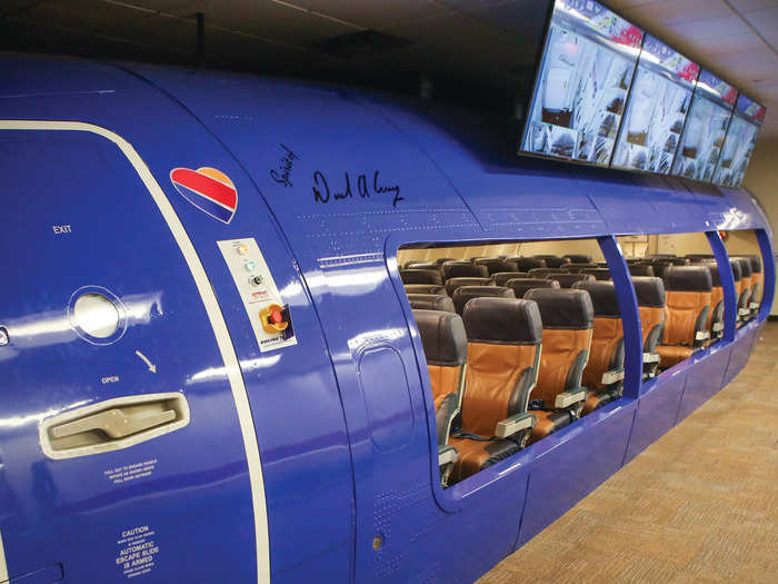 A life-size aircraft cabin where flight attendants train...