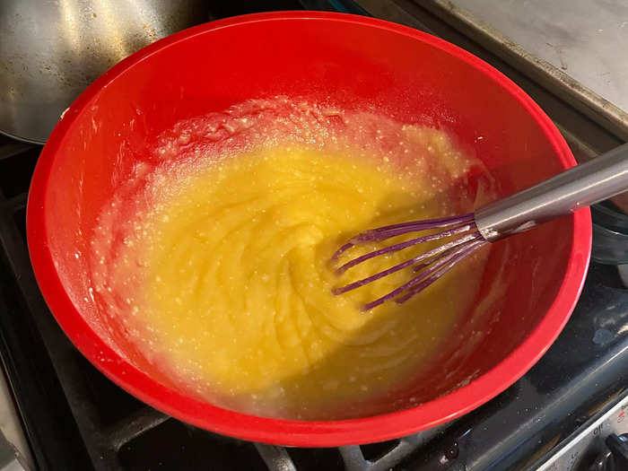 First, I melted the butter and whisked it. I then added the powdered sugar.