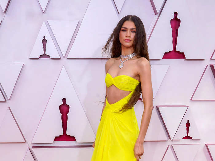 Zendaya looked like a ray of sunshine at the 2021 Academy Awards in a bright-yellow dress with a midriff cutout.