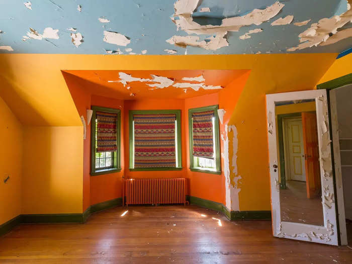 Another bedroom featured a bold pop of orange on its walls.