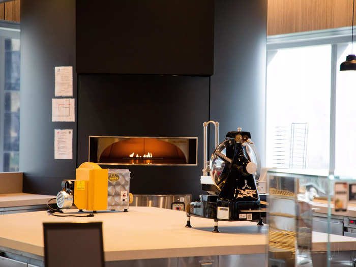 In the corner of the cafeteria, a wood-fired pizza oven can dish out hot meals to hungry bankers quickly.