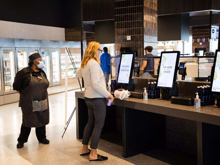 In the cafeteria, staffers can pay for their meals on a touch screen after grabbing what they need from multiple food stations.