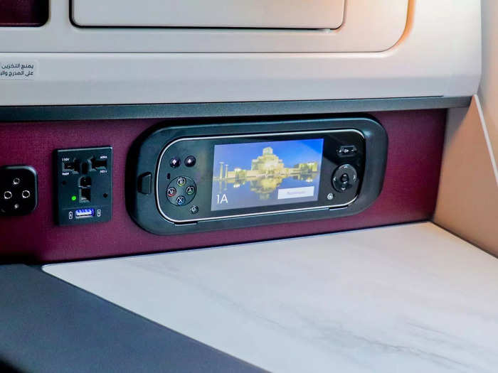 Also controlling the in-flight entertainment system is a large tethered remote with a touch-screen of its own. It also acts as a game controller.