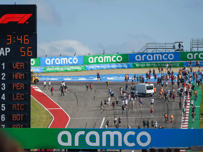 Fans raced down the hill to get a good view of the podium celebration.