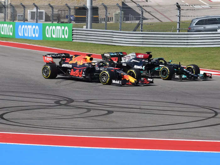 Verstappen, left, and Hamilton battle for the lead on the first lap.