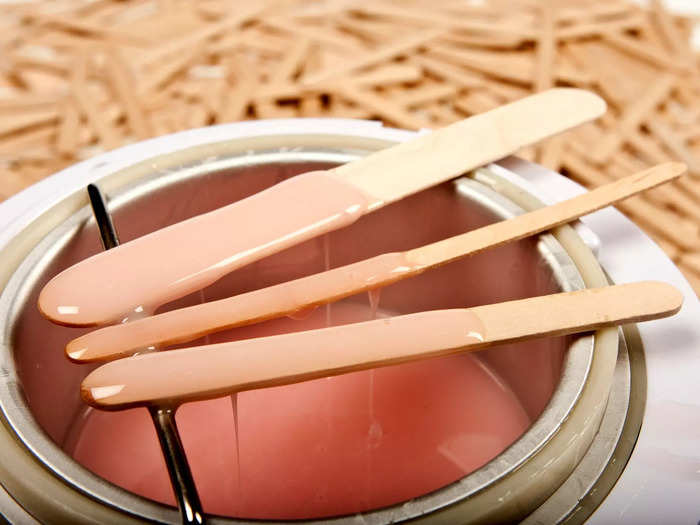 You should leave any spa that has wooden sticks already in the wax pot before your service.