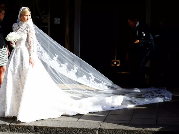 Nicky Hilton looked stunning in a high-neck lace Valentino gown for her wedding to James Rothschild in 2015.