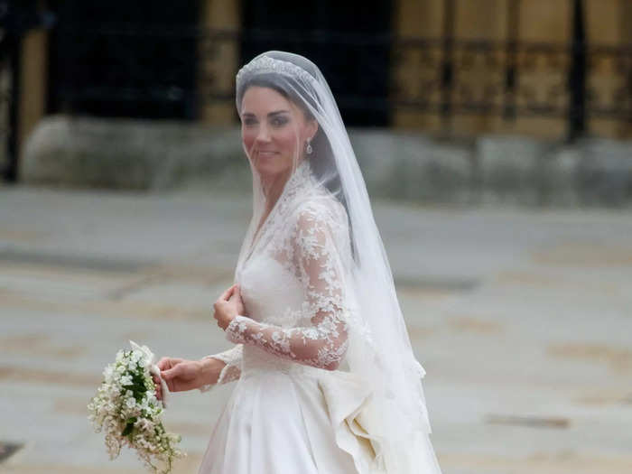 Kate Middleton wore a Grace Kelly-inspired Alexander McQueen gown with sheer lace sleeves for her 2011 wedding.