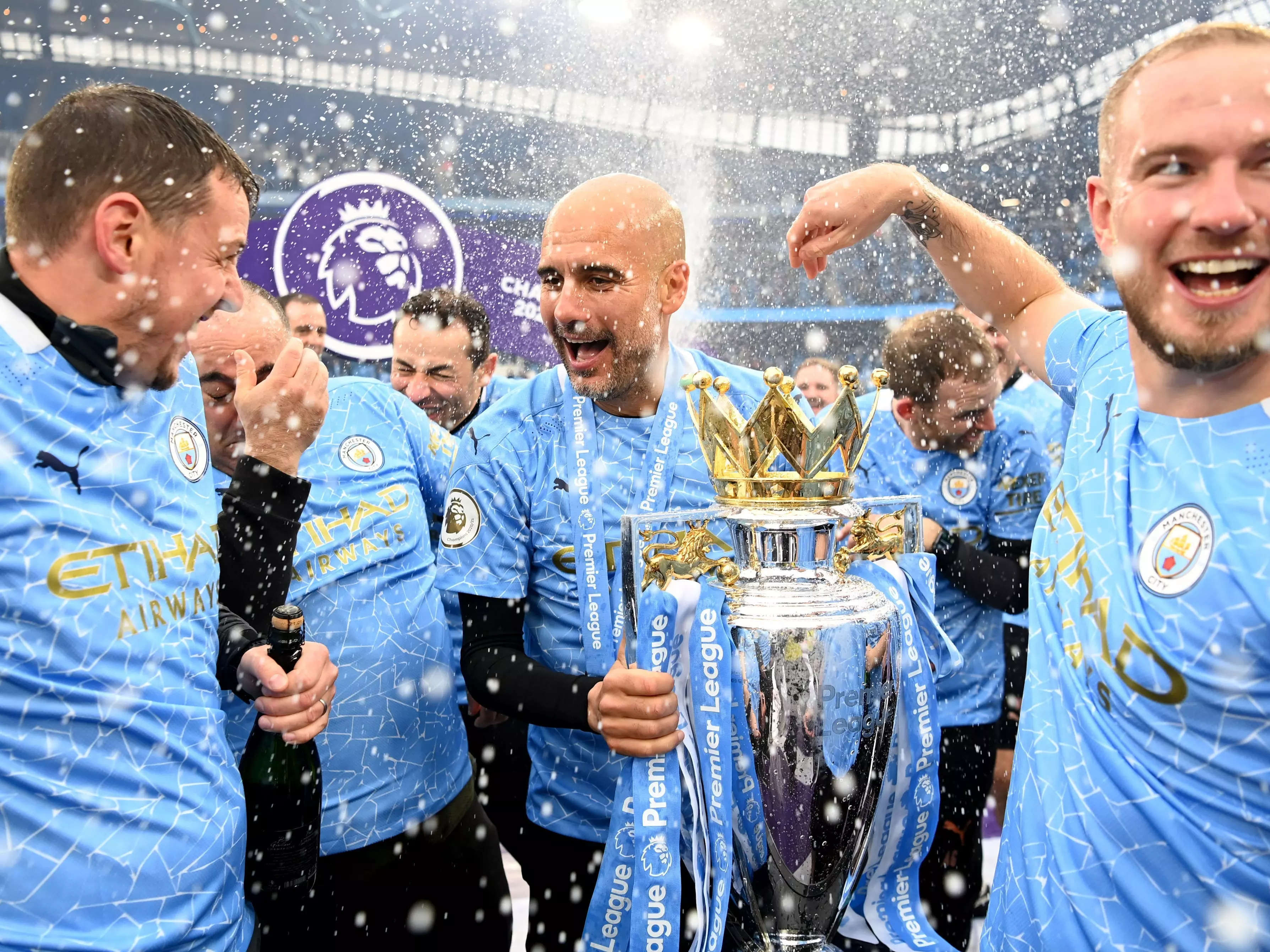 Pep Guardiola celebrates winning the Premier League