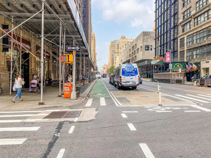 At 30th Street I join a protected bike lane with parked cars separating me from the roadway.