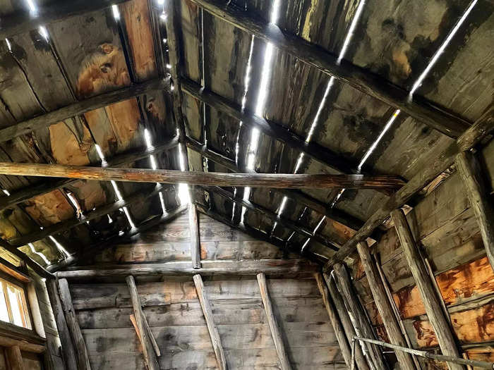 I was inside the Irvin bathhouse, where water once flowed from a nearby spring. The structure was slanted and decaying, and today the bathtub is the only thing that remains.