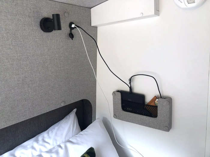 One side of the bed featured a small built-in shelf that held our portable WiFi box and the TV remote.