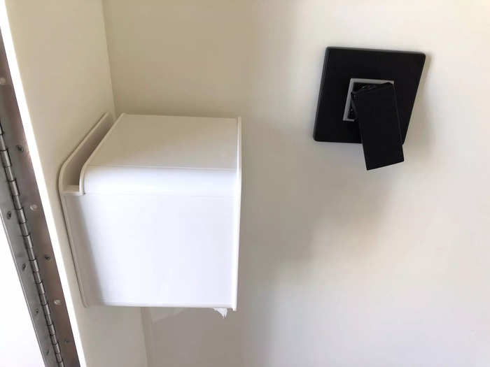 Since the shower and toilet were in the same place, the toiler paper dispenser was protected.