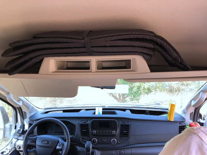 Above the dashboard was a hidden storage space where all the window shades were kept.