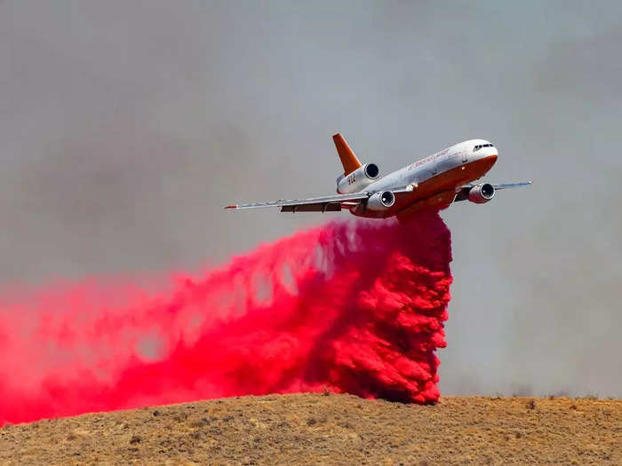 The planes are modified with three gravity feed tank systems that can carry up to 9,400 gallons of water or fire retardant known as Phos-Chek. They are programmed to do a "sequence" drop or a "split" drop, meaning they can dump the retardant all at once or in intervals.