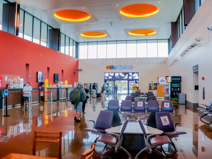 The arrival hall of the American terminal appeared no different than a traditional airport, complete with rental car counters, a Wetzel