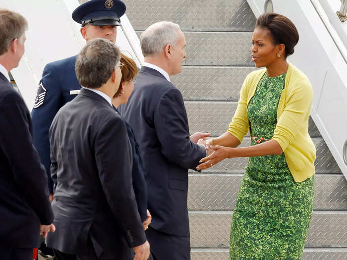 She wore the dress again, this time with a yellow cardigan, while visiting a National Guard base in March 2012.