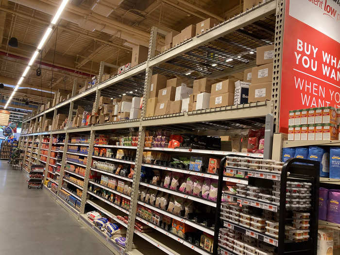 As I ventured further in, I noticed boxes stored above stocked shelves.