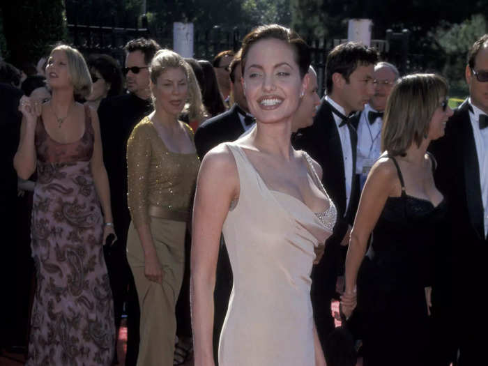 At the Emmys in September 1998, Jolie wore a beige dress with sheer paneling and an exposed studded bra.