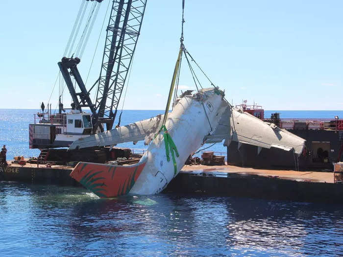 The aft section was recovered second, and the retrieval was much more challenging than the forward piece due to its size and weight, according to the NTSB. The aft section measures about 63 feet long and weighs around 48,500 pounds empty and around 60,500 pounds with the four cargo containers inside.