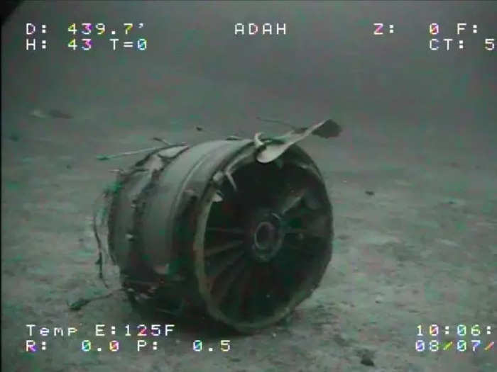 Both engines and the forward landing gear also detached from the sunken plane and a pallet of cargo was found nearby.