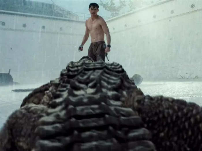 A man fights a crocodile in "The Pool."