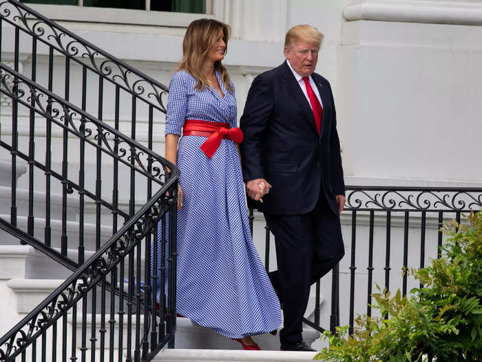 Melania wore a red belt to go with Trump