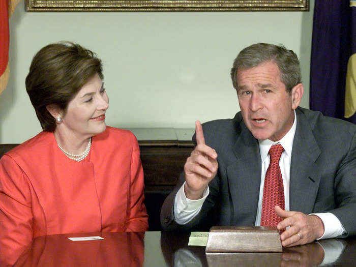 The first lady wore a coral suit that coordinated with Bush