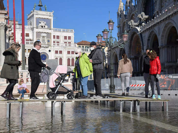 The city has adapted to the flooding by constructing elevated walkways called "gangways," such as this structure in St. Mark