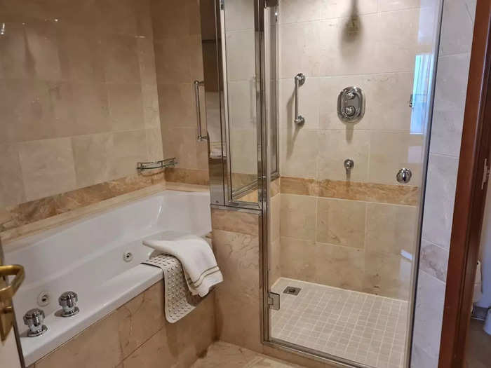 The bathroom had a bathtub and a shower.