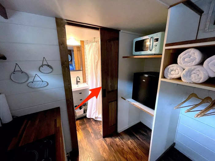 A pocket door to the bathroom took up no space when it was open but created a sense of privacy when it was closed.