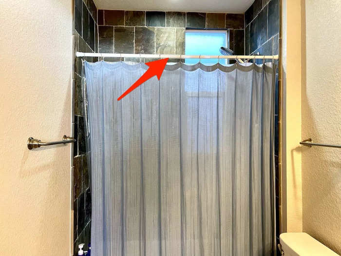 My roommate and I want to add a shower rod that creates more space inside the shower, and a metal wire could do just that.