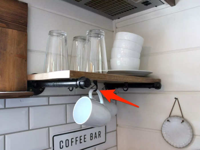 Small hooks underneath a shelf stored the tiny house