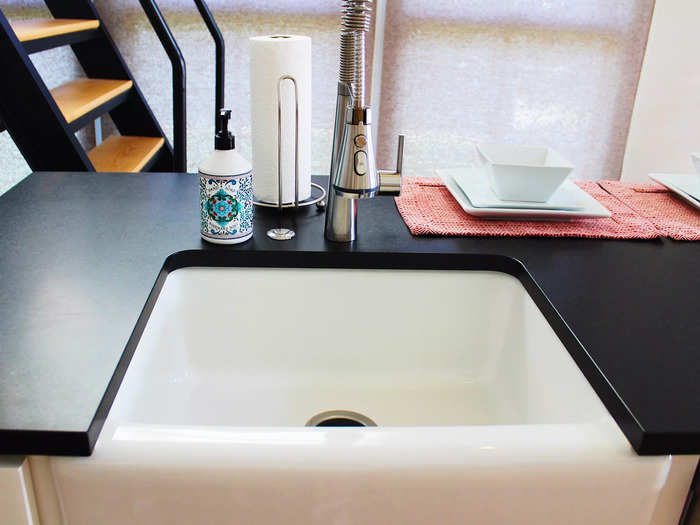 The kitchen featured a large farm sink, which is a staple in many "Fixer Upper" renovations.