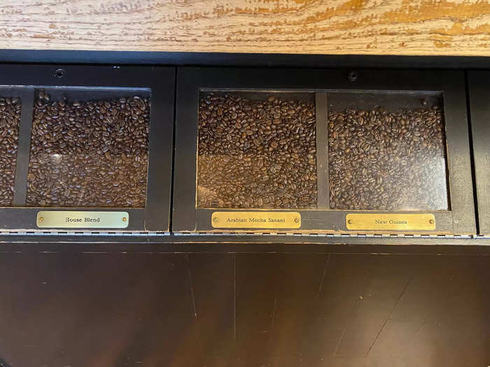 Customers can buy coffee beans in bulk at the store, and some of the brass labels identifying the blends are the same ones the store has been using for decades.